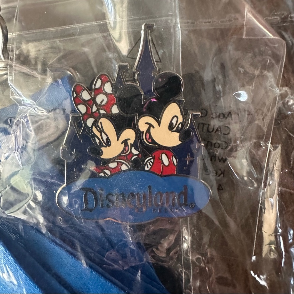 Disneyland resort blue lanyard and Mickey & Minnie Mouse pin with ID holder